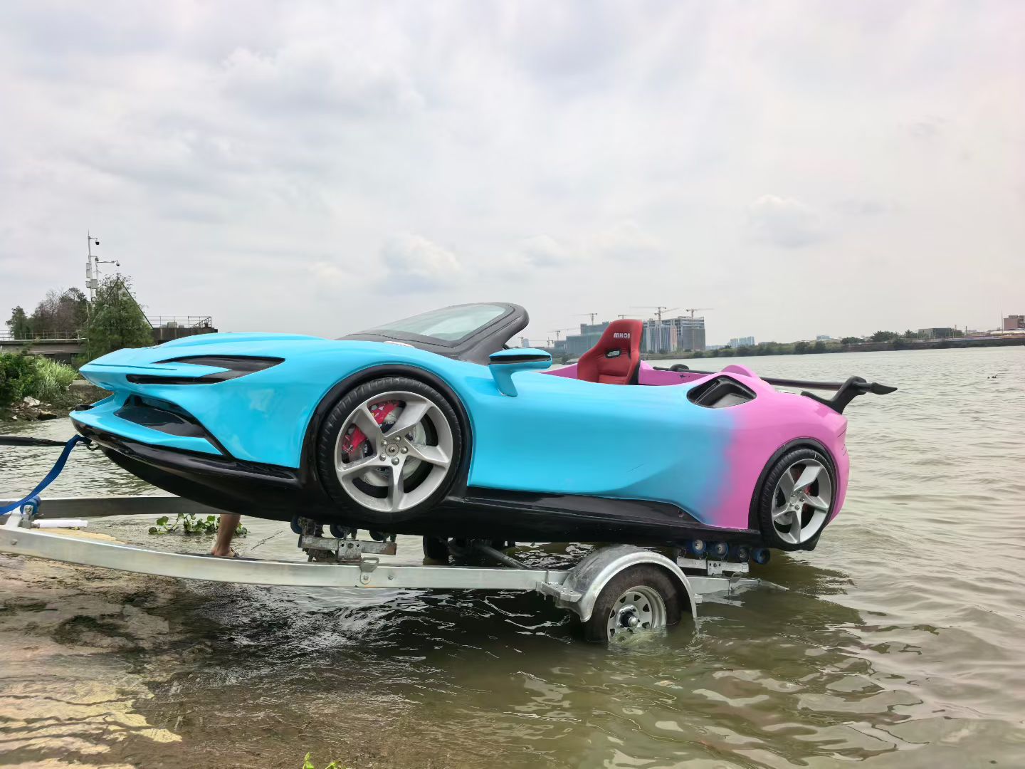 Blue and pink water supercar side profile during launch