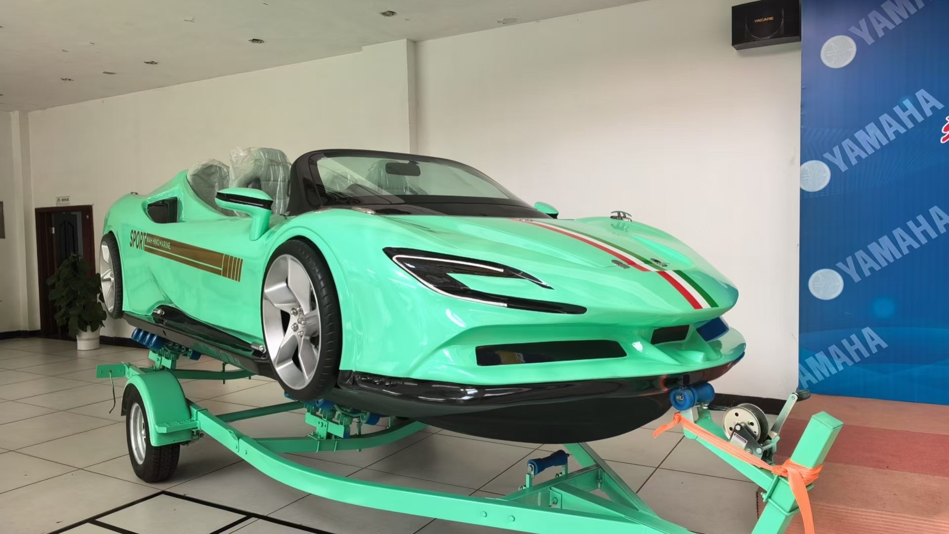 Mint green water supercar displayed in a showroom