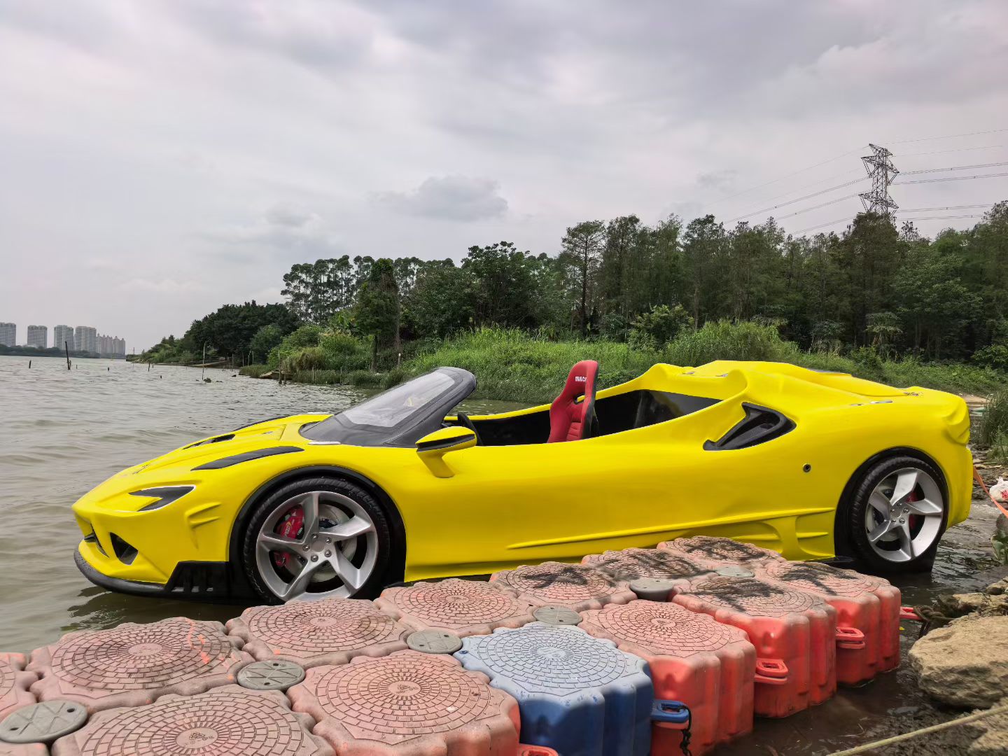 Yellow water supercar shown beside the water